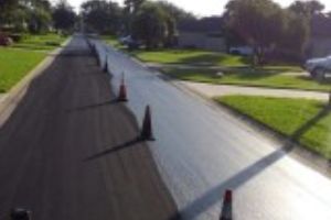 Liquid road sealcoating