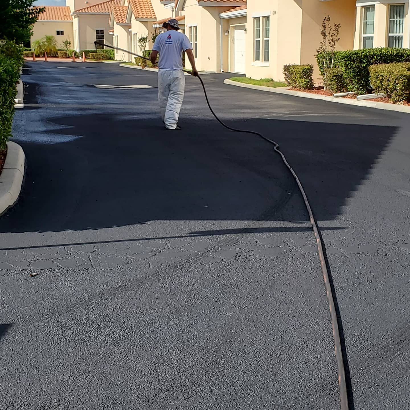 RPM staff sealcoating asphalt pavement